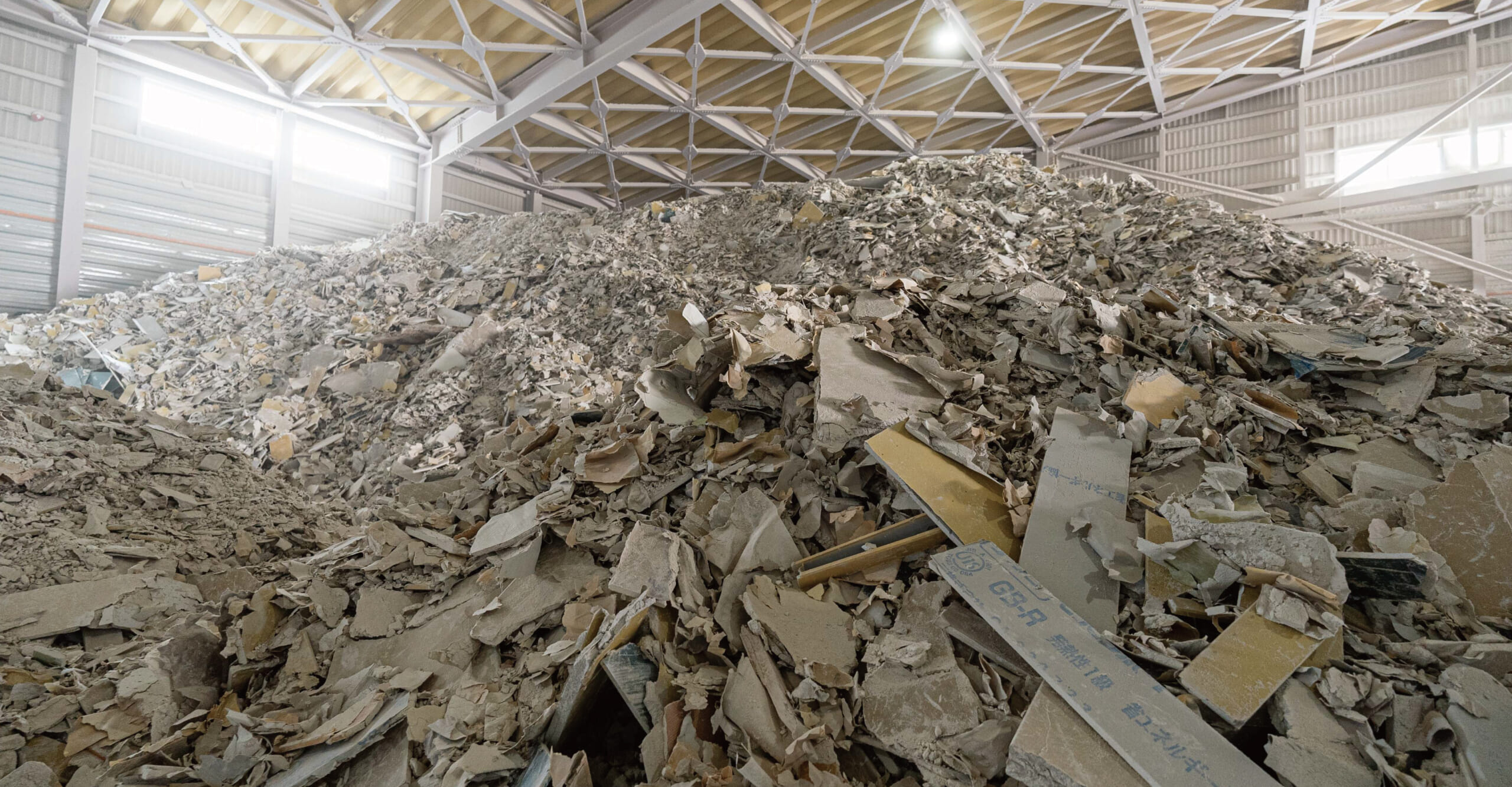 船場、麻布台ヒルズや虎ノ門ヒルズ等における石膏ボードの水平循環量・CO₂削減量を定量化